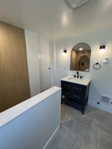 Bathroom renovation featuring new vanity, mirror, and updated finishes in Cincinnati, Ohio.
