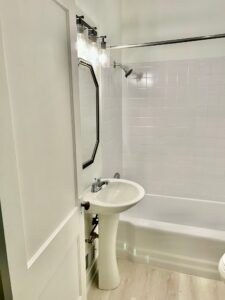 Bathroom refresh in Pleasant Ridge | Cincinnati—OH feat. reglazed tub and tile, updated fixtures, and luxury vinyl flooring