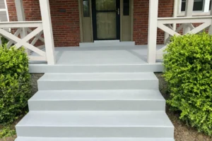 Newly poured concrete porch, front steps, and curved walkway with custom color-matched at brick home in Kennedy Heights, OH.