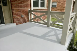 Newly poured concrete porch, front steps, and curved walkway with custom color-matched at brick home in Kennedy Heights, OH (right angle).