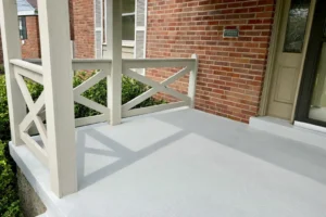 Newly poured concrete porch, front steps, and curved walkway with custom color-matched at brick home in Kennedy Heights, OH (left angle).