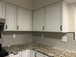 Modern subway tile backsplash installation with granite countertops in Forest Park Cincinnati Ohio